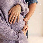 image of a pregnant woman holding her belly.