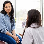 image of a woman speaking with a doctor